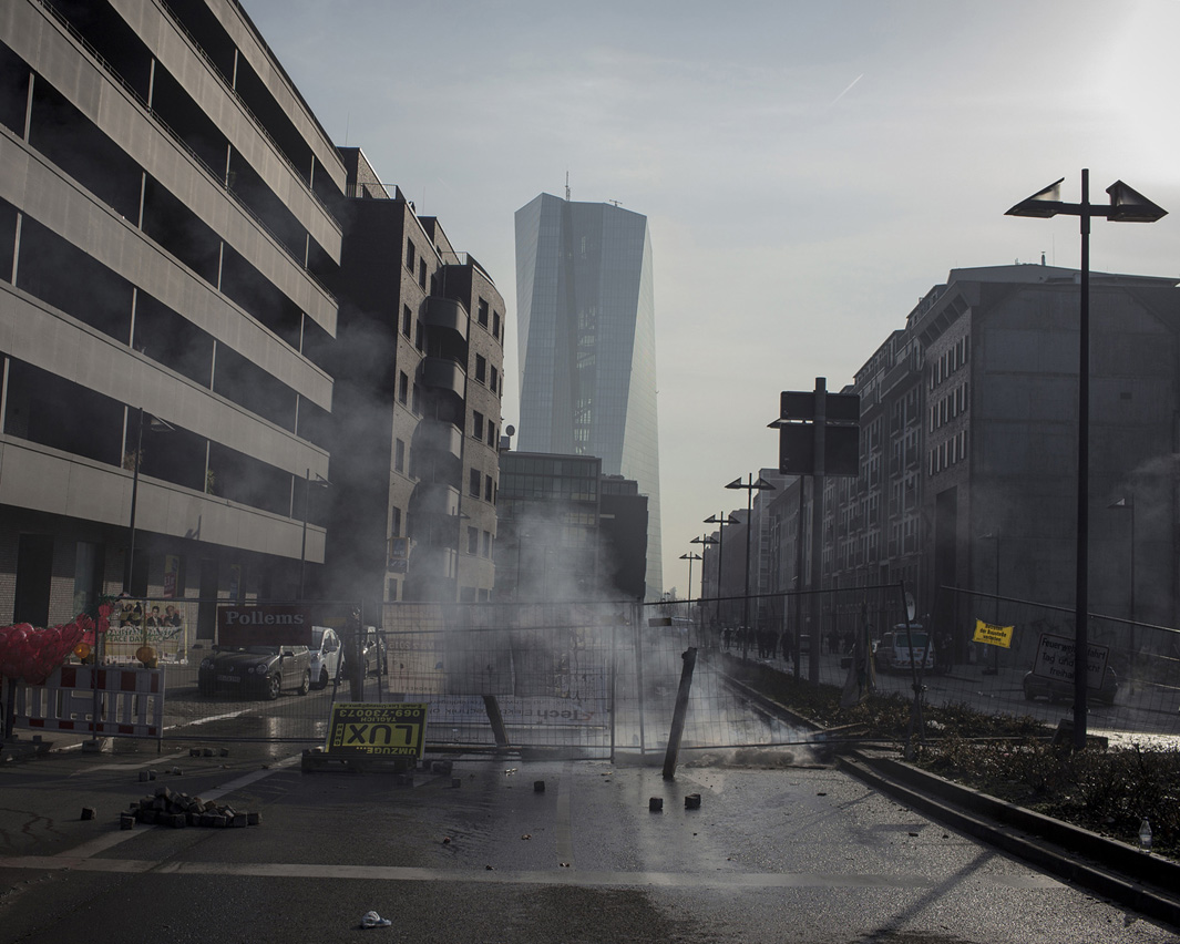 The new headquarters of the European Central Bank is seen in the background of a road barricaded by violent demonstrators. Protests against the inauguration of the new European Central Bank (ECB) building escalated quickly in the early morning through far left "black block".