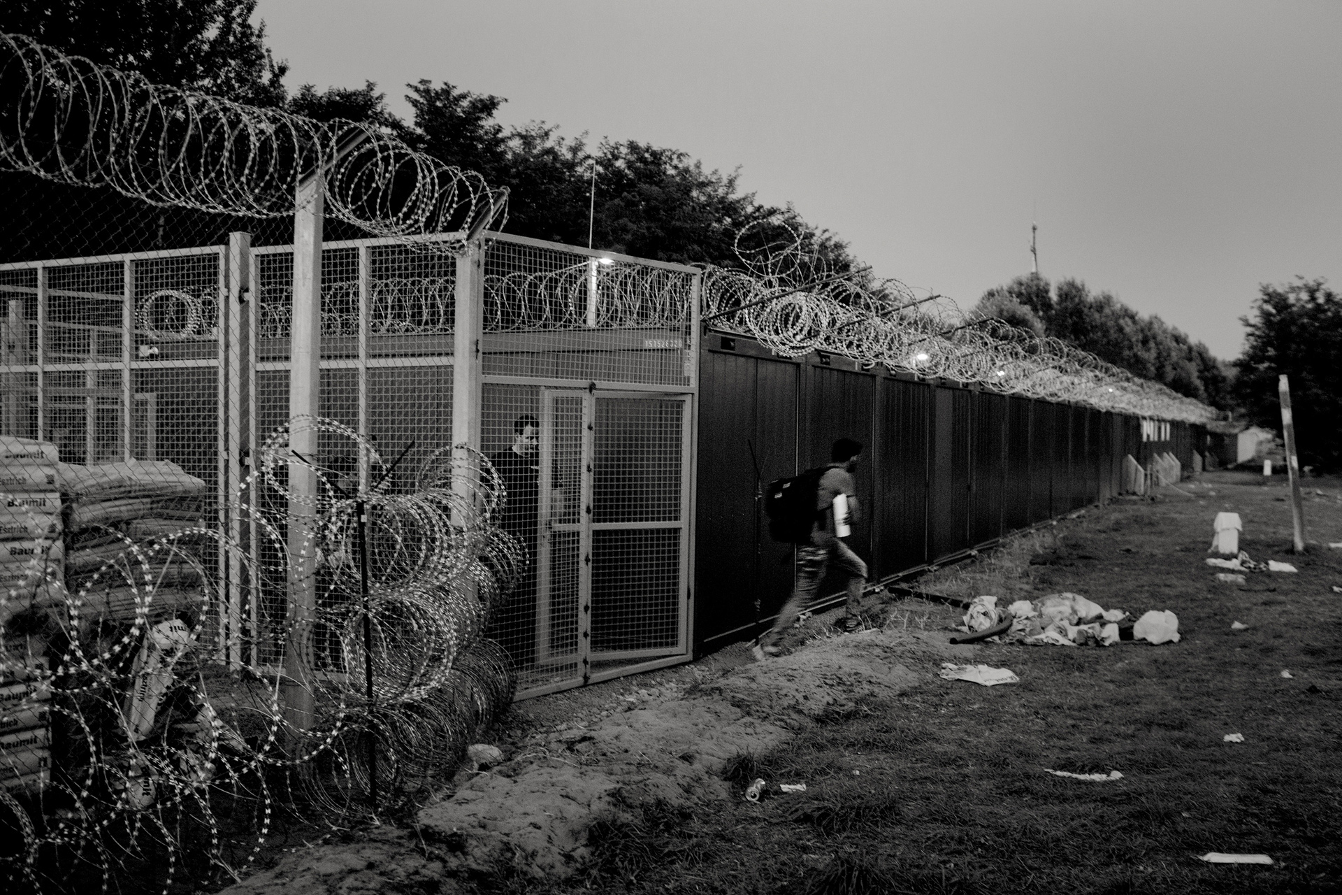 15 September 2015, Horgos, Serbia. Horgos-Roeszke border crossing.
A refugee rejected by Hungarian authorities leaves the so-called "transit zone" back into Serbia.
Hungarian authorities have installed fences on the common border with Serbia in to reestablish control on the migration movement. A tightening law passed by the right-wing Hungarian government took effect on midnight of 14-09-2015.
